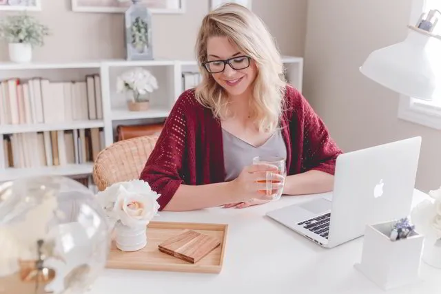Business owner working in her bright home studio